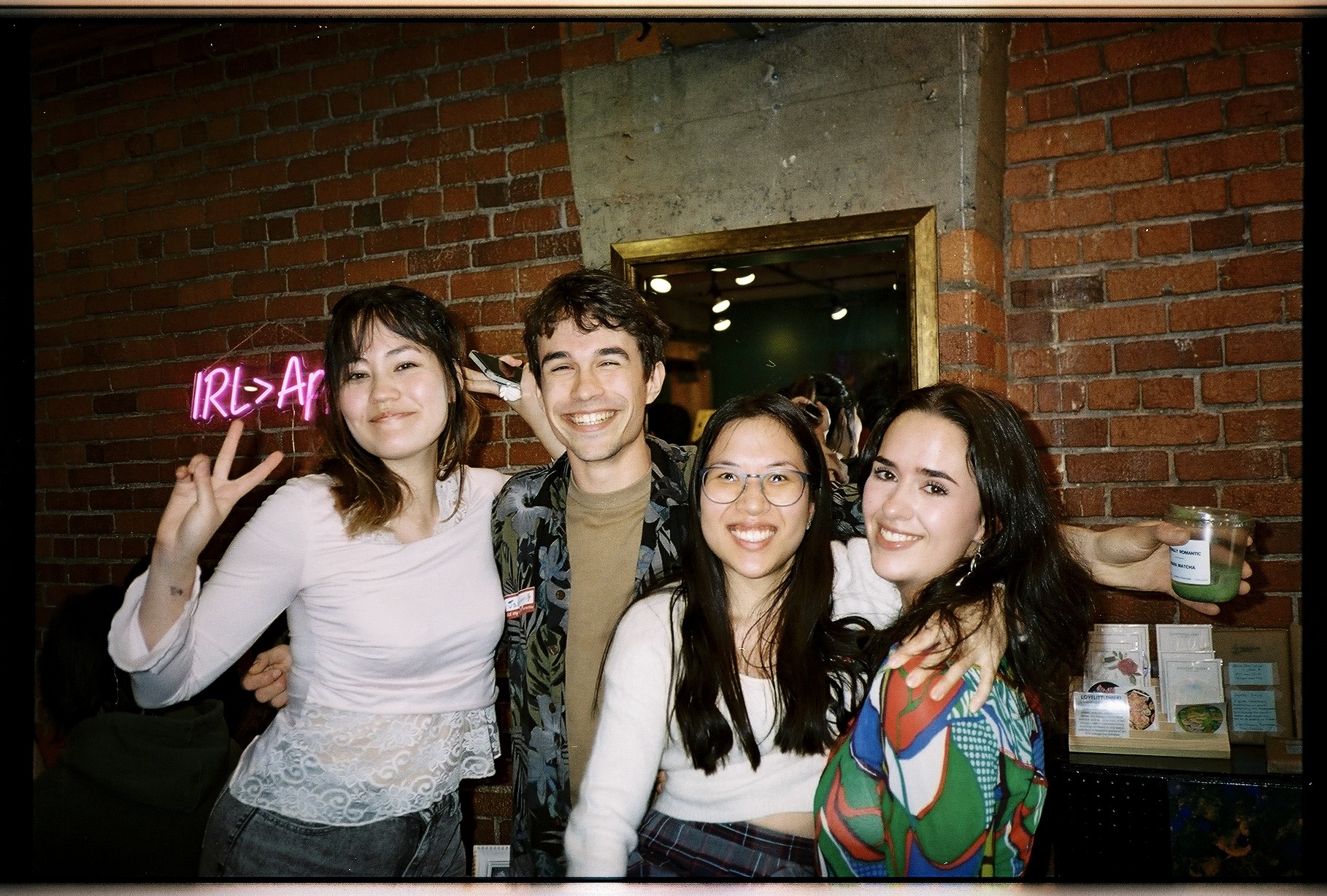 Four friends posing at an Actually Romantic singles night in Vancouver